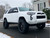 White Toyota 4Runner with Black American Truxx AT165 Warrior