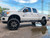White F250 Platinum with 26x14 American Truxx DNA