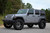 Silver Jeep Wrangler with American Truxx Lonestar Wheels