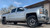 Silver Chevy Silverado 1500 with American Truxx Sweep Wheels