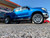 Blue Toyota Tundra with Chrome American Truxx Exclusive Rims