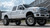 White 6.7 Ford Powerstroke With Polished American Force Blade Wheels