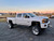 Polished American Force Traxx Wheels on White Duramax