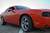 Orange Dodge Challenger with American Racing AR105M Anthracite Torq Thrust M