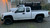 White Chevy Colorado with AR172 American Racing Black Baja Wheels