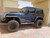 Blue 2 Door Jeep Wrangler with Black American Racing AR201 Rims