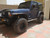 Blue 2 Door Jeep Wrangler with Black American Racing AR201 Rims