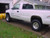 White Chevy Silverado 1500 With American Racing AR23 Silver Wheels