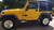 Yellow Jeep Wrangler with American Racing AR62 Outlaw Wheels