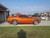 Orange Dodge Challenger with Torq Thrust American Racing Wheels
