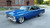 Blue Chevy Nova with American Racing Torq Thrust SL VN425 Wheels