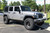 Silver Jeep Wrangler JK with Black Rhino Abrams Black Rims