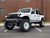 White Jeep Gladiator with Black Rhino Axle Wheels