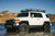 White Toyota FJ Cruiser with Black Rhino Barricade Wheels