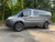 Grey Ford Transit with Gunmetal Black Rhino Bandolier Wheels