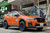 Orange Subaru Forester with Black Rhino Boxer Black Rims