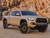 Tan 2022 Toyota Tacoma with Black Rhino Arsenal Tan Rims
