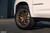 White Chevrolet Suburban RST with Satin Bronze Forgestar X14 Concave Wheels
