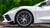 Rohana RFX10 brushed titanium wheels on a white Chevrolet Corvette.