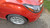 Orange Chevy Spark with Silver Enkei J10 Wheels