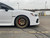 White Subaru WRX with Titanium Gold Enkei GTC02 Wheels