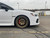 White Subaru WRX with Titanium Gold Enkei GTC02 Wheels
