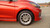 Orange Chevy Spark with Silver Enkei J10 Wheels