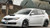 White Subaru STI Hatchback with Black Enkei NT03+M Wheels