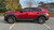Red Mazda CX50 with Bronze Enkei Overlander Wheels