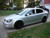 Silver Chevy Cobalt With Black Enkei PF01 Wheels