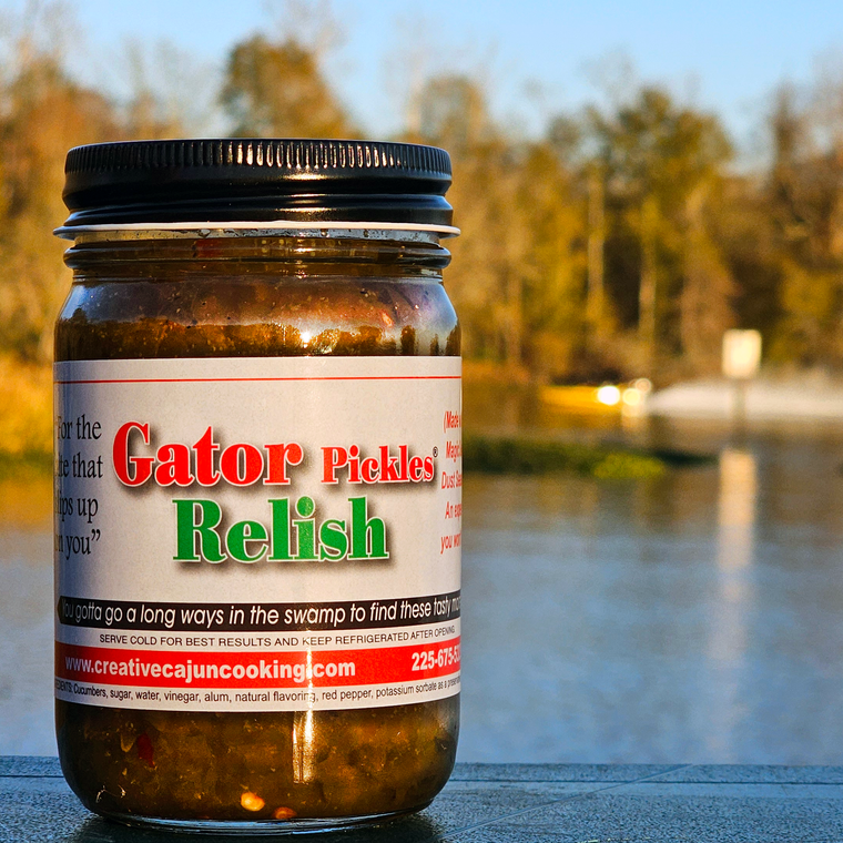 It makes you say, Wow!  A little sweet and a little heat, also, with its own unique taste.  You will never want to make a potato salad or eat a hot dog without it!
A sweet and flavorful pickle relish with the "bite that slips up on you"
Made with real Magic Swamp Dust Seasoning.
An experience you won't forget!