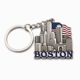 Boston skyline souvenir keychain featuring a detailed cityscape, patriotic flag backdrop, and bold Boston lettering.