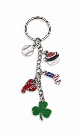 New England-themed metal keychain with enamel charms including a baseball, lobster, clam chowder bowl, Massachusetts state outline with American flag, and green shamrock.