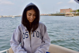Sport Grey full-zip hooded sweatshirt featuring navy Boston appliqué lettering, front zipper closure, adjustable hood, and front pouch pockets.