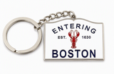 Metal Boston souvenir keychain featuring an Entering Boston sign design with a red lobster graphic and enamel detailing.