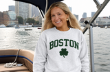 Boston Shamrock Crewneck Sweatshirt in Ash Heather featuring bold green "BOSTON" collegiate lettering and a green shamrock graphic on the front.