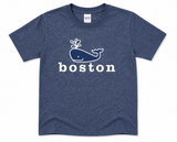 Youth Boston T-shirt featuring a playful spouting whale graphic and "boston" lettering, available in Heather Navy and Light Pink.