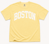 Comfort Colors Butter Yellow Boston T-Shirt featuring white collegiate BOSTON lettering on a relaxed unisex garment-dyed cotton tee.