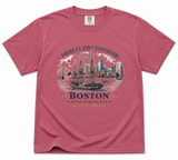 Comfort Colors Boston 250th Anniversary t-shirt featuring a historic tall ship sailing in Boston Harbor with city skyline artwork and commemorative 1776-2026 design.