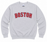 Sport Grey Boston crew sweatshirt featuring a bold red and navy collegiate BOSTON graphic on the front. Available in adult sizes Small through XL.