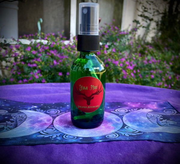 Yule Mist - Christmas Scent - Essential Oil Spray. Our Yule Mist is the perfect Christmas scent! This blend is like walking in a snowy, northern forest. Use as a room spray or perfume body spray! 

The essential oils in this blend are Black Spruce, Balsam Fir, Pine, Juniper, and Orange. It is infused with bloodstone chips. Dreamer Apothecary