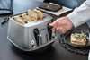 De'Longhi, CTIN4003.TB, Distinta X Titanium Four Slot Toaster, Titanium - with toast De'Longhi, CTIN4003.TB, Distinta X Titanium Four Slot Toaster, Titanium - with toast