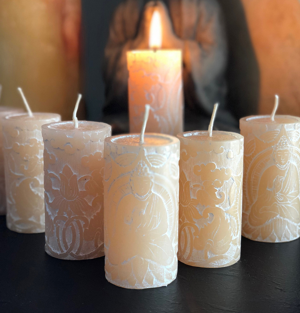 Lotus altar candle displayed on sacred space altar, small jasmine meditation candle creating soft illumination in spiritual home setting
