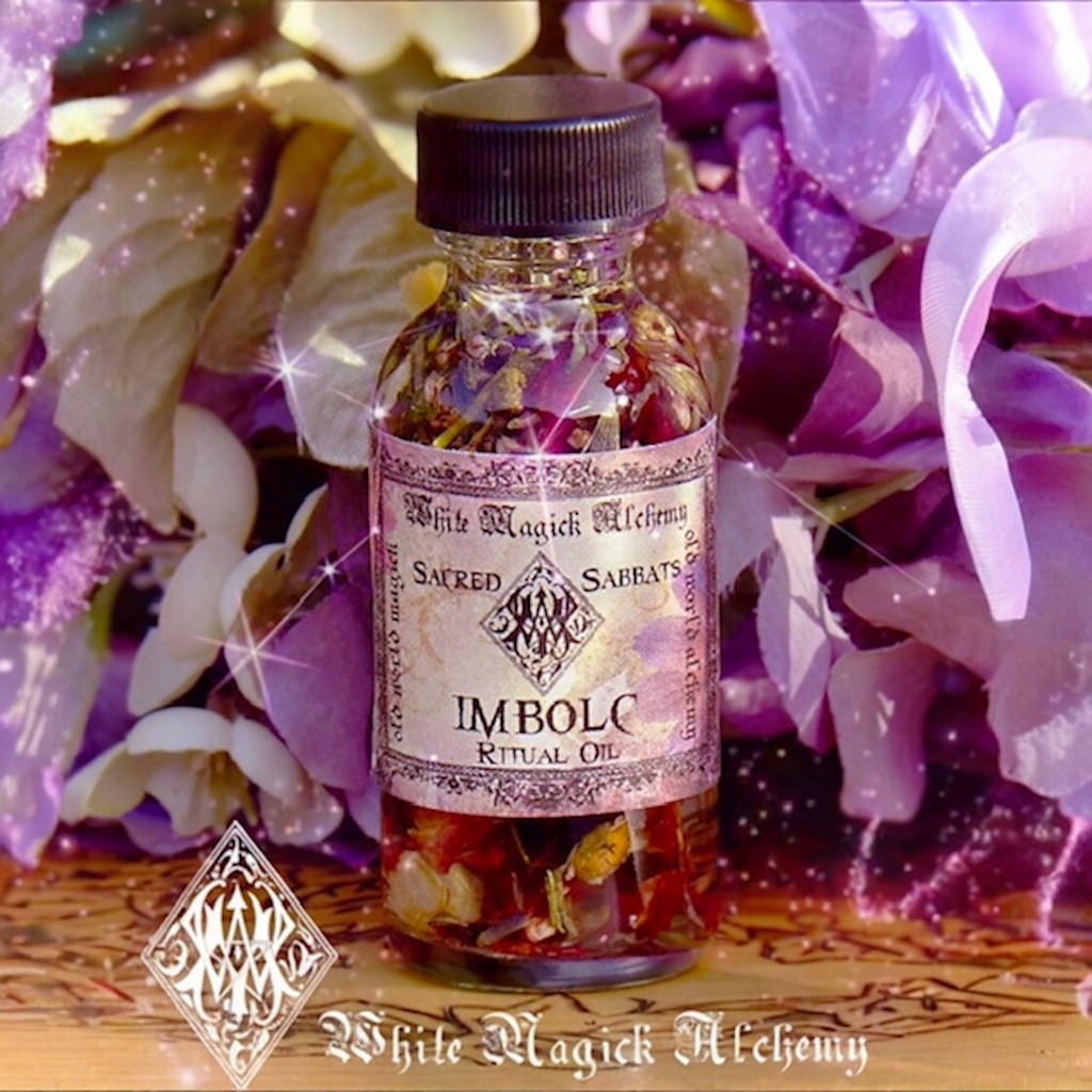 imbolc ritual oil in bottle with flowers