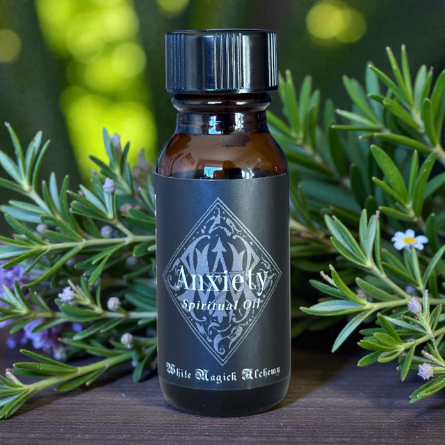 anxiety stress relief calming oil on table with herbs lavender eucalyptus outside 