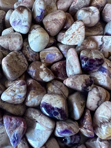 A selection of Amethyst tumbled gemstones for sale at White Magick Alchemy
