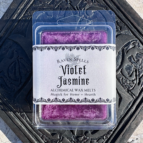 purple violet jasmine wax melts on white magick alchemy logo wood table