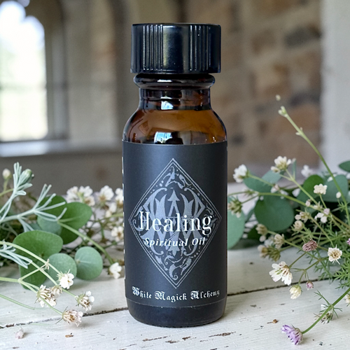 healing oil bottle with healing herbs in a spiritual ambianace