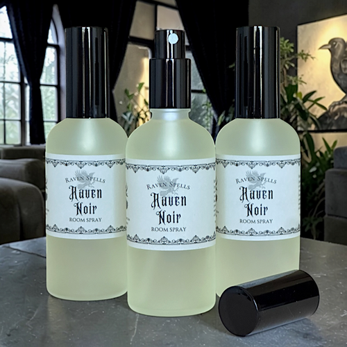 Raven Noir Room Spray bottle styled as a ritual home fragrance mist with amber jasmine champa and sandalwood essence evoking a dark mystical atmospheric aesthetic