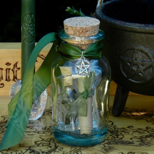 money drawing spell jar with green candle resin oil and pentacle charm for prosperity and financial abundance